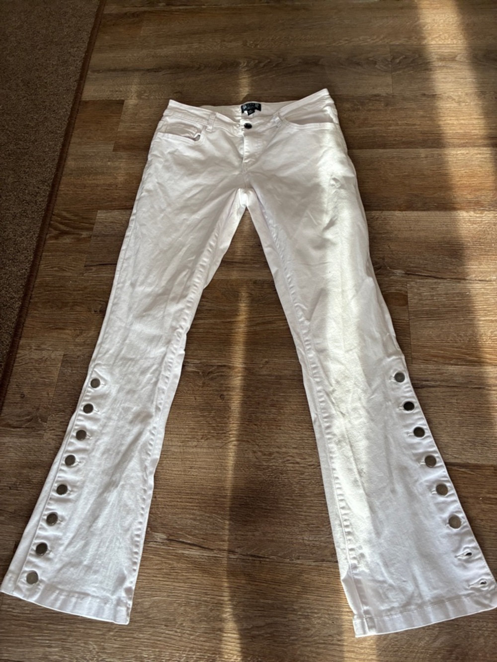 White denim flare button jeans